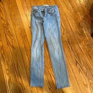 Light blue pair of “super skinny” jeans